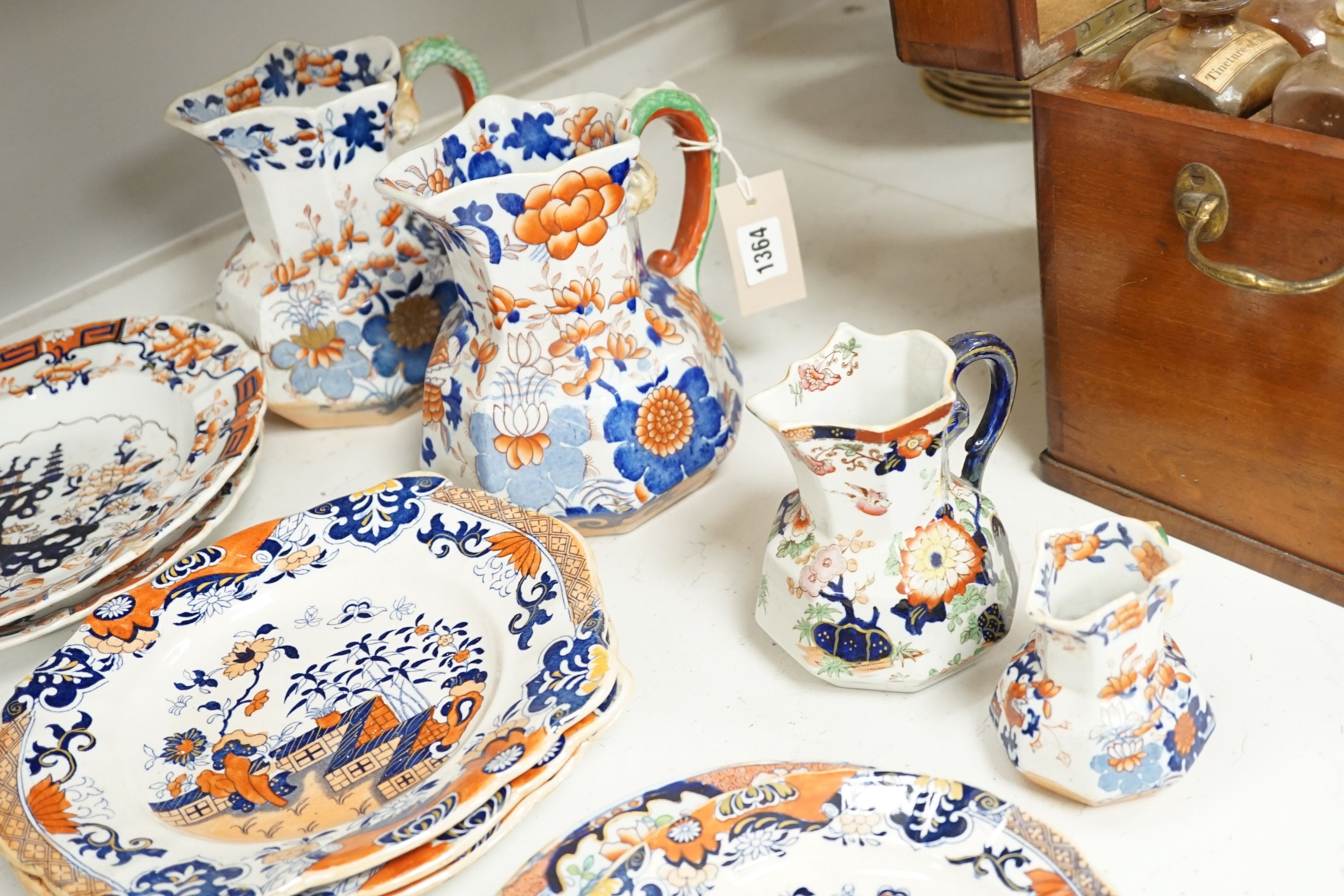 Four graduated Mason’s hydra jugs, tallest 19cm., and eight various ironstone or earthenware plates